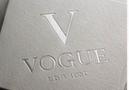 Embossed Vogue lettering on textured paper